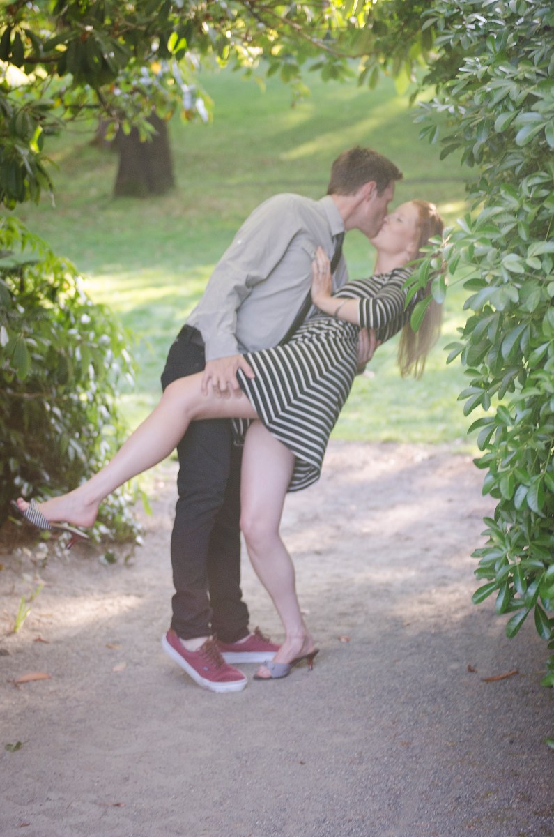 Bri and Ryan kissing in the park